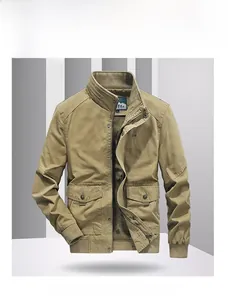 Detail of khaki cotton jacket showing vintage chest embroidery and stand-up collar