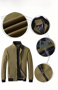 Detail view of khaki cotton jacket with stand collar and plaid lining texture