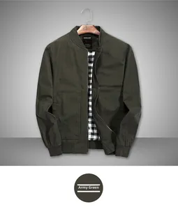 Detail view of military green cotton bomber jacket with black and white checkered lining
