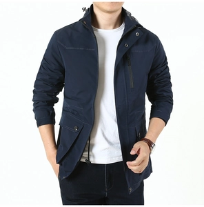 Detail of navy blue windproof jacket featuring vertical chest zipper and flap pockets