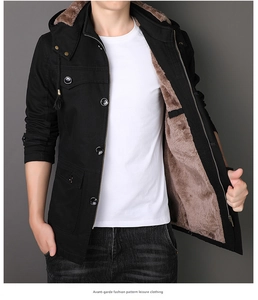 Detail of men's winter parka showing thick brown faux fur lining and black outer fabric