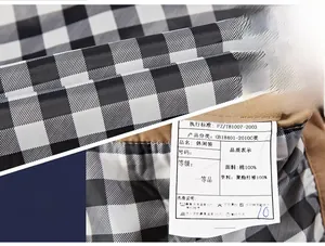 Detail of cotton jacket inner lining featuring black and white checkered pattern and wash label