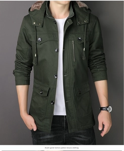 Detail of army green military parka showing hood with plush lining and multi-pocket design