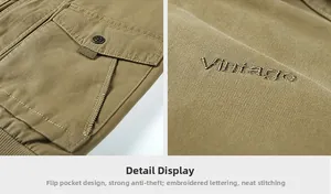 Detail of khaki jacket showing flap pocket with snap button and Vintage embroidery
