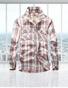 Detail of military style plaid shirt with double chest pockets and button-down closures