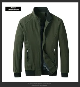 Front detail of army green cotton jacket featuring stand collar and ribbed cuffs