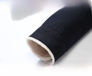 Detailed close-up of jacket cuff featuring warm fleece lining and durable double stitching
