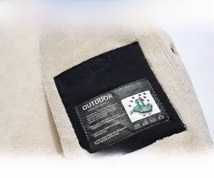 Close-up of winter jacket fleece lining and functional labels for outdoor windproof use