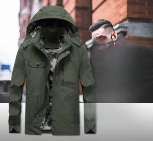 Detail showing the military green jacket with a detachable hood and camouflage lining