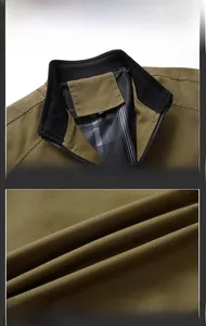 Detail of classic stand collar jacket with ribbed cuffs and dark plaid lining fabric