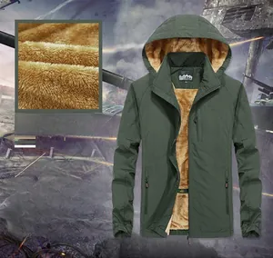 Detail of green men's hooded jacket featuring warm brown faux fleece lining and zip pockets
