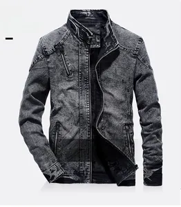 Detail view of washed dark grey denim jacket with moto stitching and decorative zippers