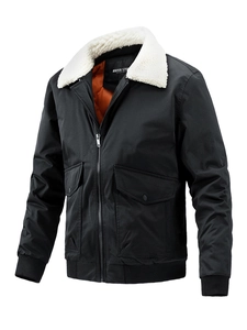 Detail of bomber jacket showing white faux fur collar and orange quilted lining