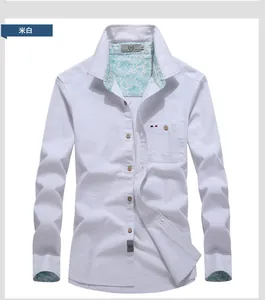 Detail of off-white shirt featuring paisley lining and pocket with tricolor ribbon