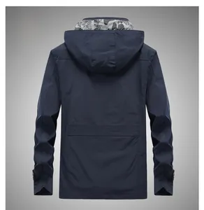 Back view of dark blue hooded windbreaker with camouflage lining and stitching detail