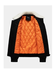 Close-up of black men's jacket with orange quilted lining and white faux shearling collar