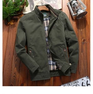 Detail of army green casual jacket with stand collar and classic plaid inner lining