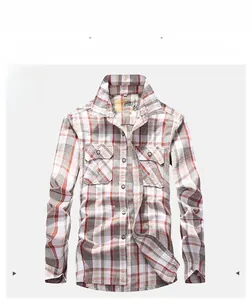 Detailed close-up of men's red checkered long sleeve shirt with dual buttoned chest pockets