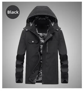 Detail of black hooded jacket featuring grey camo lining and metal zipper closure