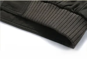 Detailed close-up of the ribbed elastic hem on a men's heavy winter jacket