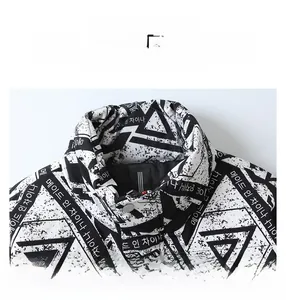 Detail of high stand collar on winter down jacket with black and white geometric print