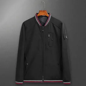 Men's reversible black bomber jacket with striped ribbed collar and utility sleeve pocket