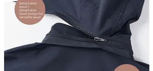Detailed macro view of detachable hood zipper on dark blue windbreaker jacket