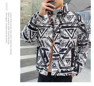 Close-up of geometric print puffer jacket featuring vibrant orange zipper details and stand collar