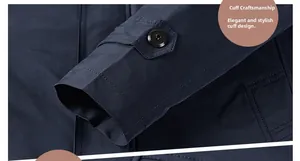 Detail of adjustable buttoned cuff on dark blue men's trench coat with fine texture