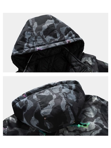 Detail of hooded camouflage jacket with diamond-quilted lining and splash ink pattern print