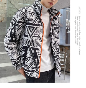 Detail of men's puffer jacket with black and white prints and bright orange zipper closure