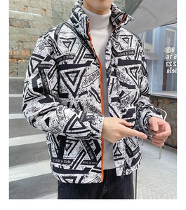 Detailed view of winter down jacket with geometric print and orange contrast zipper