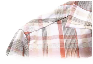 Close-up of reinforced shoulder stitching on a plaid long-sleeve casual shirt for men
