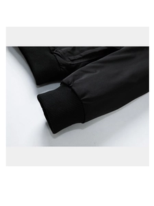 Close-up of ribbed knit cuffs on a black men's casual jacket with smooth fabric