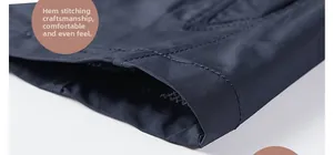Close-up of high-quality double-row stitching on the dark blue men windbreaker hem