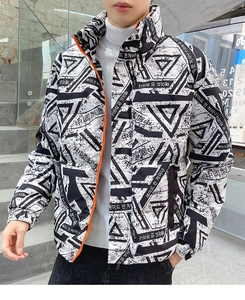 Detail of men's winter down jacket featuring bold geometric print and contrast orange zipper