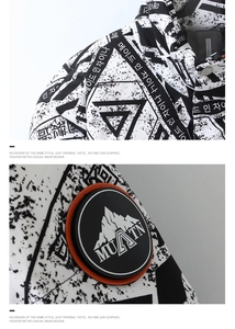 Detail of winter down jacket with black and white graffiti print and mountain arm badge