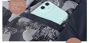 Close-up of the internal anti-theft pocket of the floral jacket showing phone storage