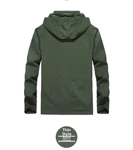 Back view of a thin army green hooded windbreaker jacket with elastic cuffs and hood