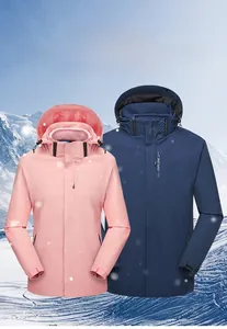 Detail of waterproof outdoor jackets featuring functional zippers and snow mountain theme