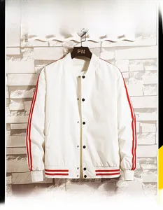 Detail of baseball jacket collar with red stripes and metal button closure