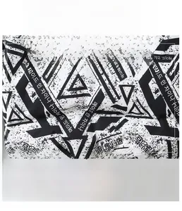 Close-up of winter down jacket fabric with geometric print and breathable texture