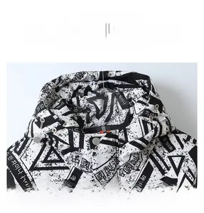 Detail of hooded jacket collar with graffiti print, adjustable drawstring and metal snaps