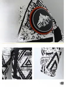 Detail of 3D rubber logo patch, diagonal pockets and elastic cuffs on printed down jacket