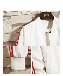Detail view of white baseball jacket featuring red sleeve stripes and ribbed cuffs