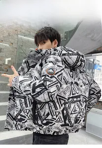 Detail of trendy graffiti print down jacket with Mountain sleeve badge and side pocket