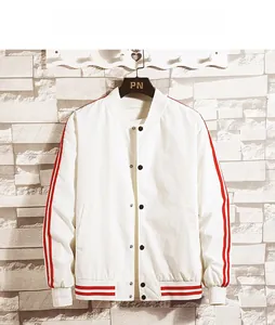 Detailed view of white baseball jacket with red stripes and metallic snap buttons