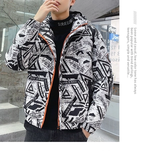 Detail of trendy down jacket featuring bold black and white prints and bright orange zipper