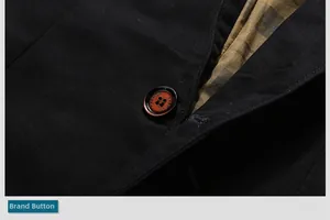 Detail of premium black twill fabric with branded fashion button and patterned lining