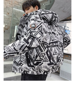 Detail of streetwear puffer jacket with bold monochrome typography print and brand arm patch